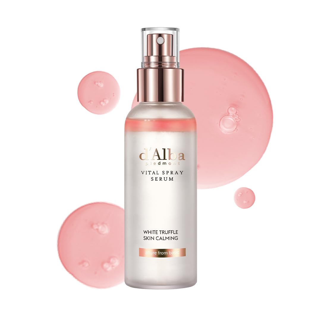 Spray visage d’Alba en flacon blanc rosé, bouchon argenté, près d’éclaboussures roses.